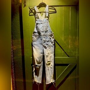 Free people distressed overalls. Ankle length. Size 24